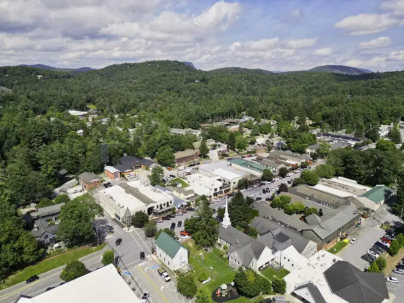 Aerial view of downtown Highlands, NC, tucked into forested Blue Ridge mountains