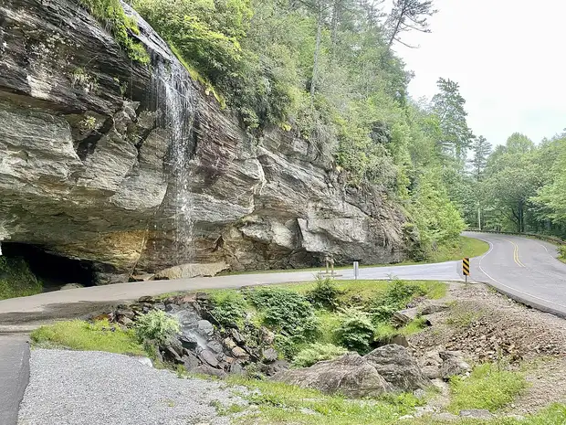 Bridal Veil Falls cascading beside US-64 in the Cullasaja Gorge