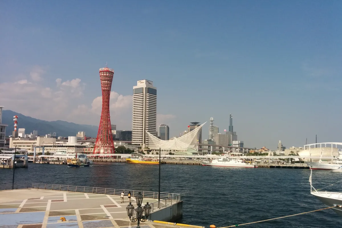 The red Kobe Port Tower beside Meriken Park on the harbour