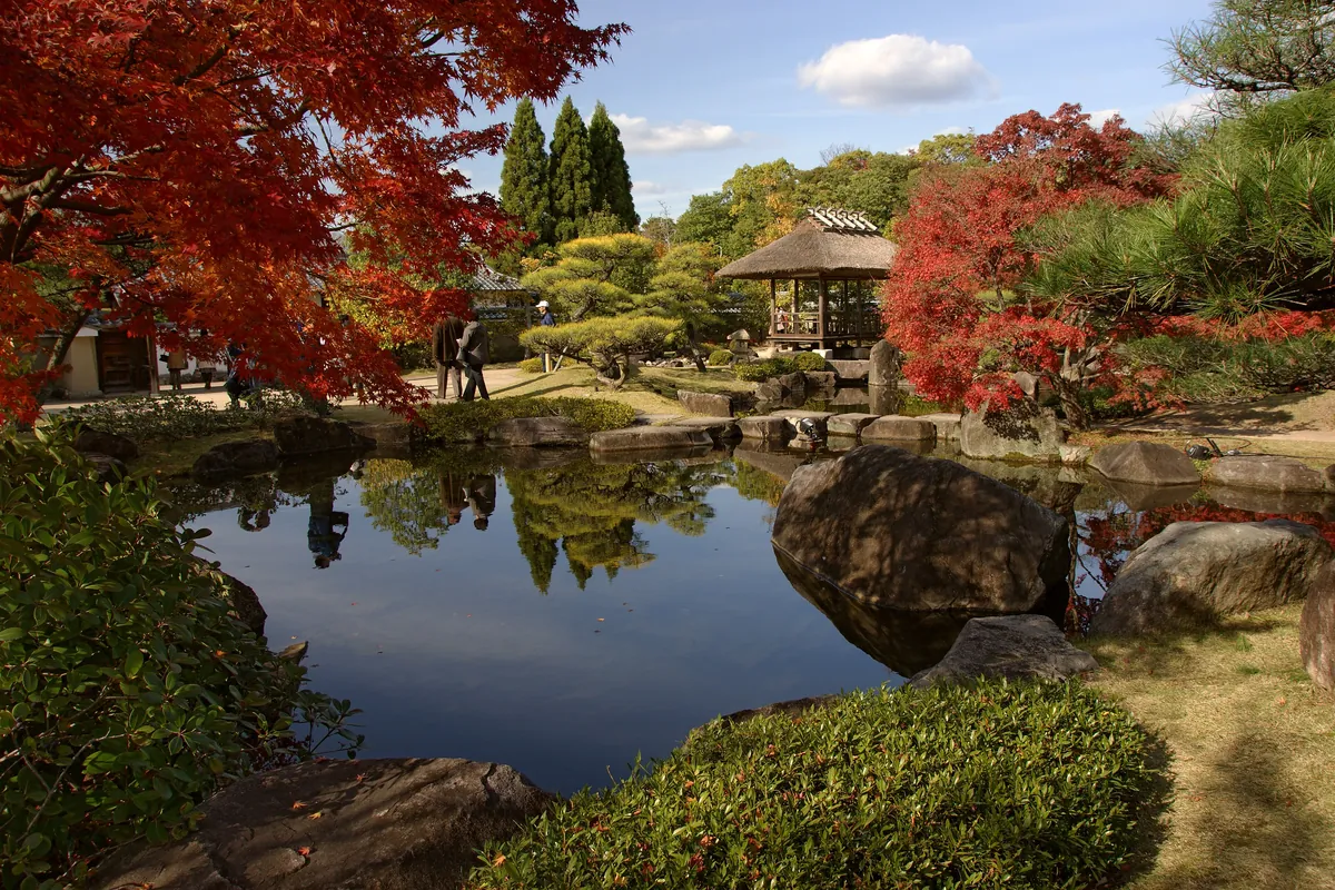 A pond and pine trees in Kōko-en garden beside Himeji Castle