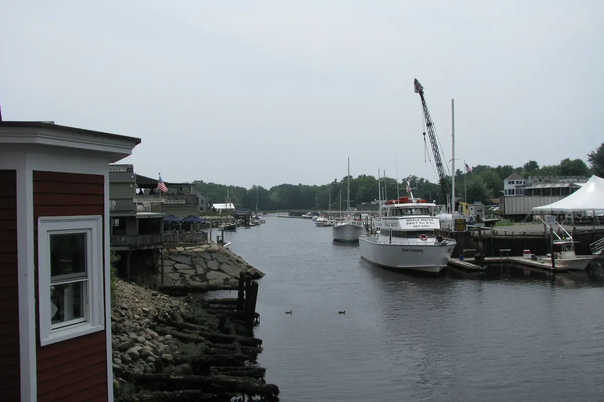 Looking south down the Kennebunk River from Dock Square, with boats moored along the docks