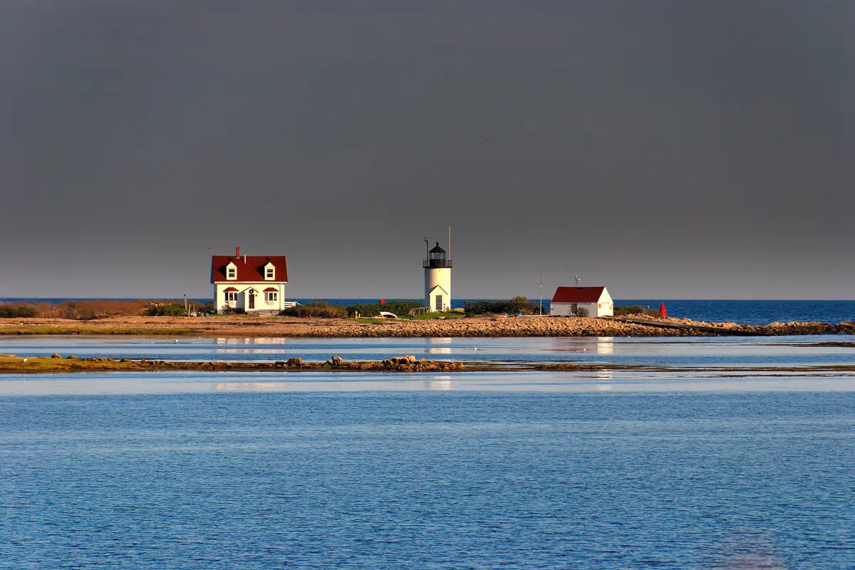 Goat Island Light, a small white lighthouse and red-roofed keeper’s house on a low island off Cape Porpoise