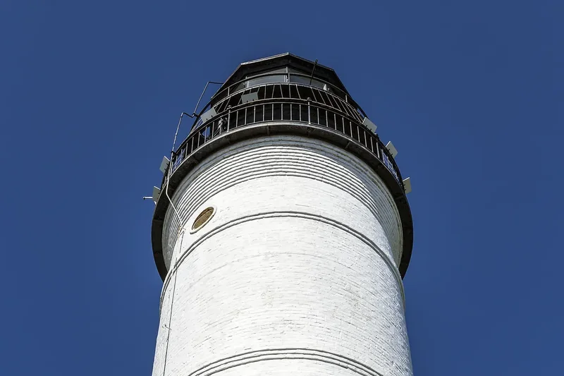 The white Key West Lighthouse and the keeper’s quarters on Whitehead Street