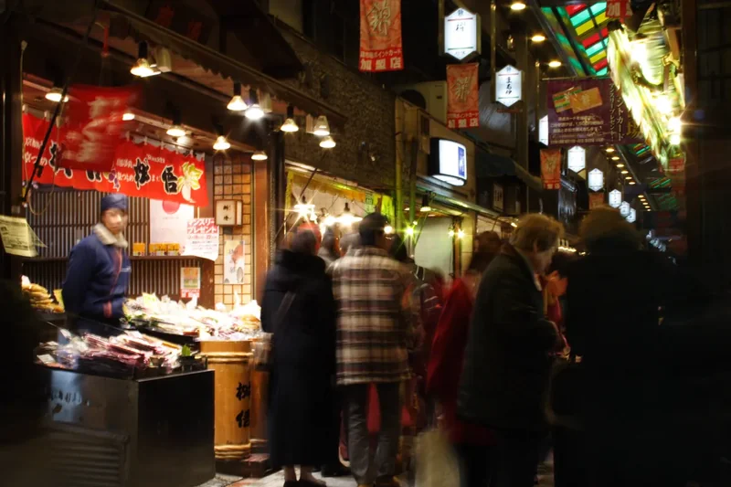 Shoppers under the covered arcade of Nishiki Market in Kyoto at year’s end