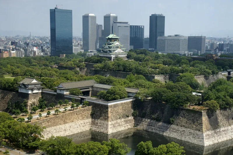 The main tower of Osaka Castle above its stone walls