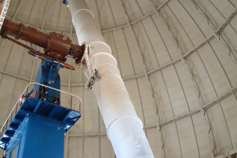 The Yerkes 40-inch refracting telescope, a long blue tube on its pier inside the dome