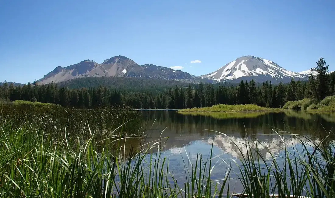 Lassen Peak and Chaos Crags rising above Manzanita Lake
