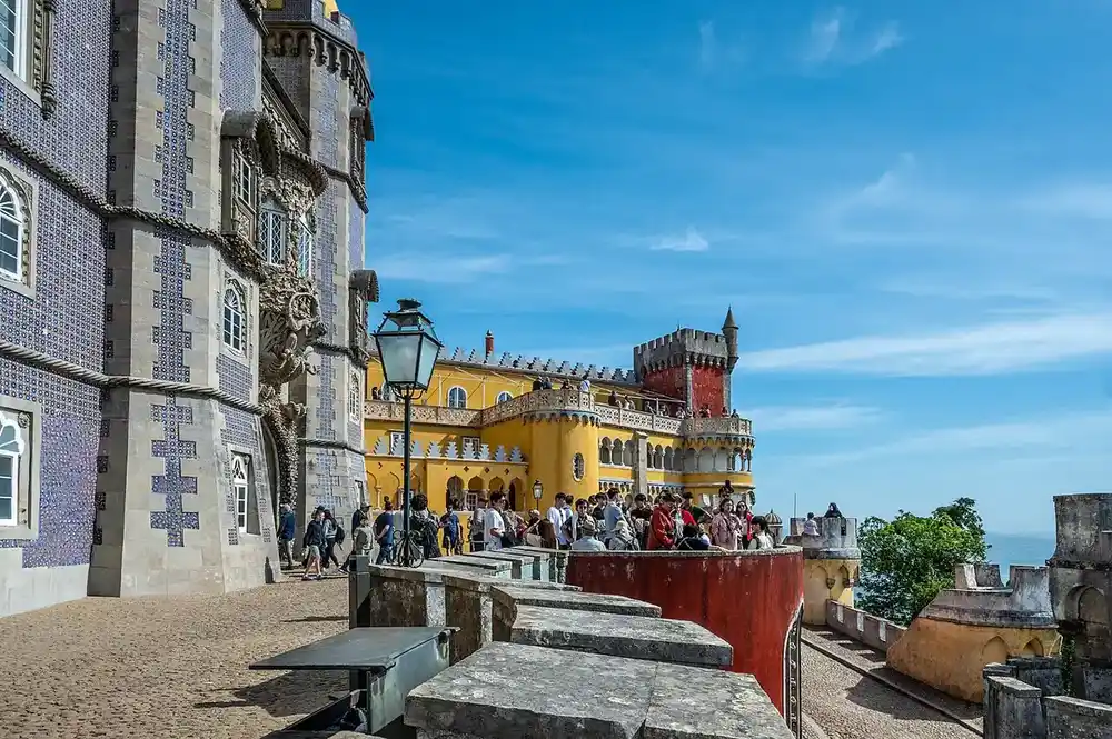 Pena Palace's yellow and red facades with the azulejo tower, Sintra