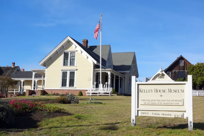 The Kelley House Museum, a historic wooden house with its sign, in Mendocino village