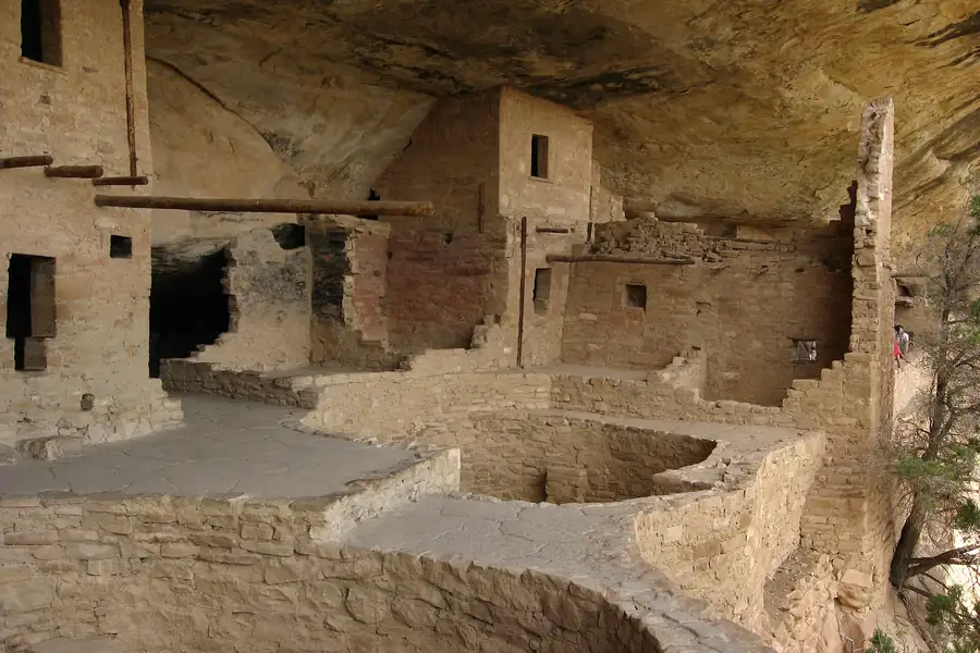 Inside Balcony House with tour visitors