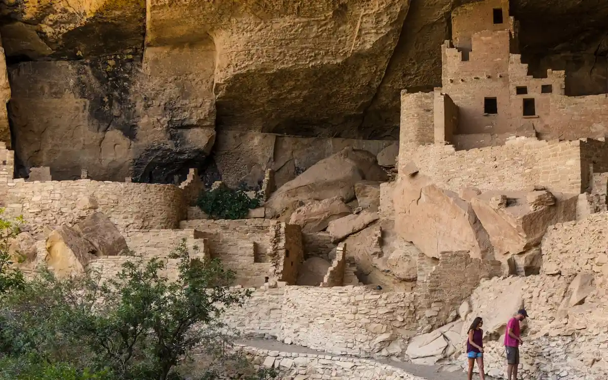 Cliff Palace at Mesa Verde National Park, the largest cliff dwelling in North America, with visitors for scale