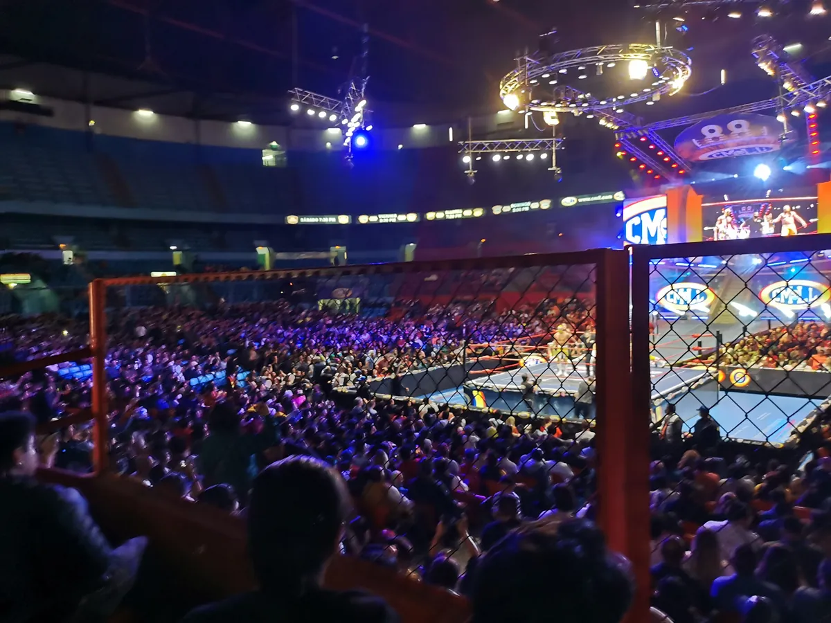 Lucha libre wrestlers in the ring at Arena México