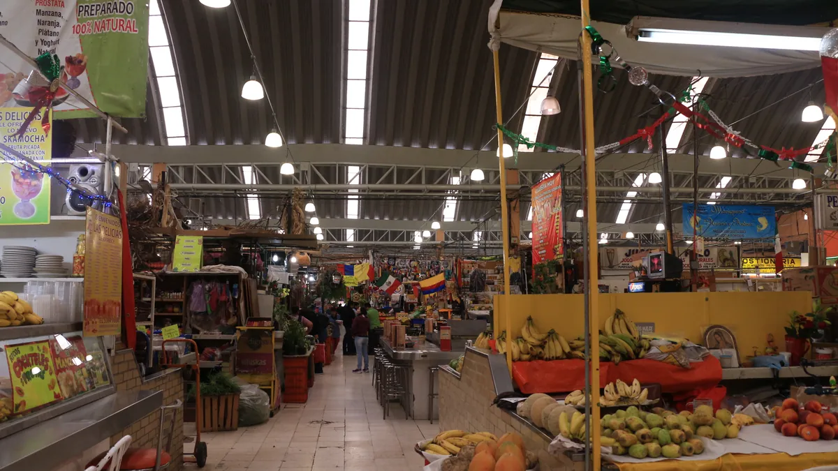Fruit and vegetable stalls inside the Mercado de Medellín in Colonia Roma
