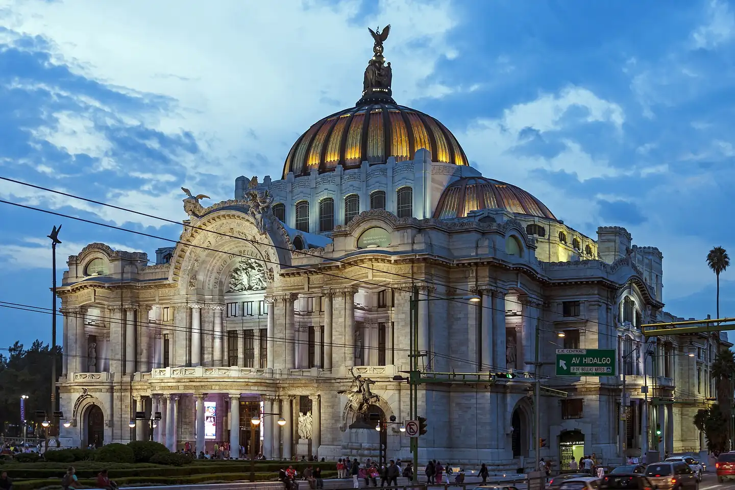 Photo: Palacio de Bellas Artes lit in the evening, seen from across Eje Central Lázaro Cárdenas.