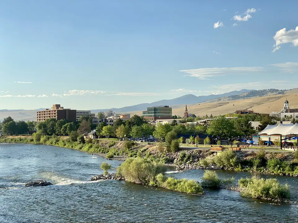 The Clark Fork riverfront with downtown Missoula and Caras Park