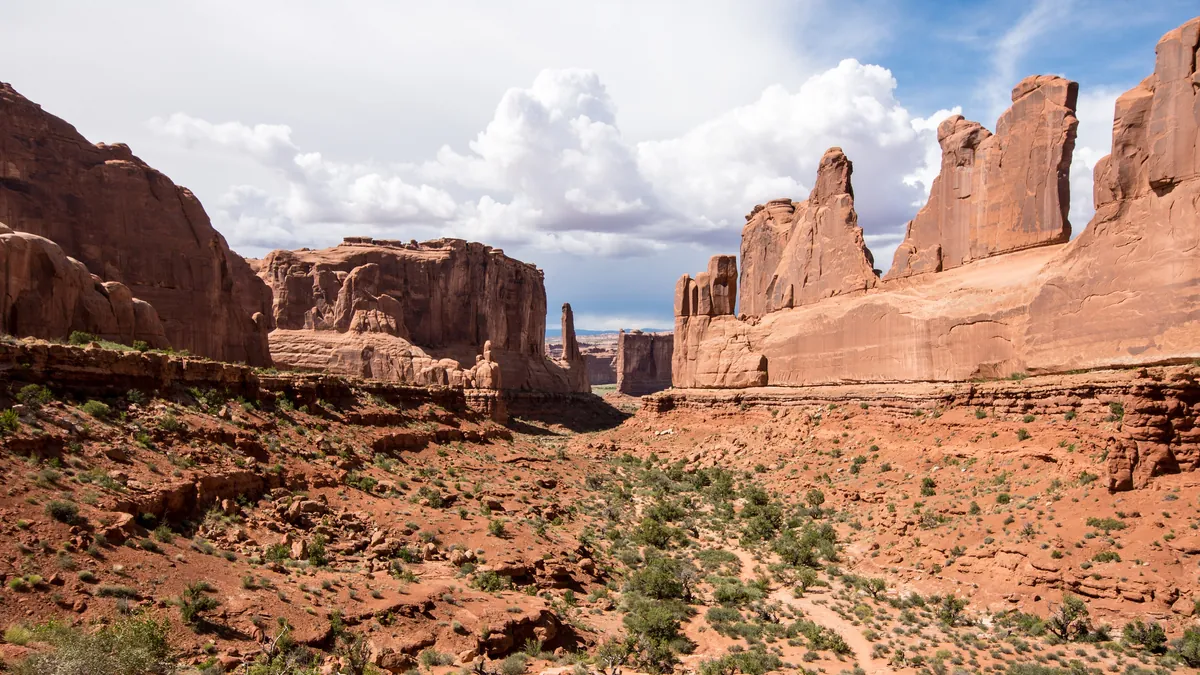 Tall red sandstone fins along Park Avenue in Arches National Park, Utah