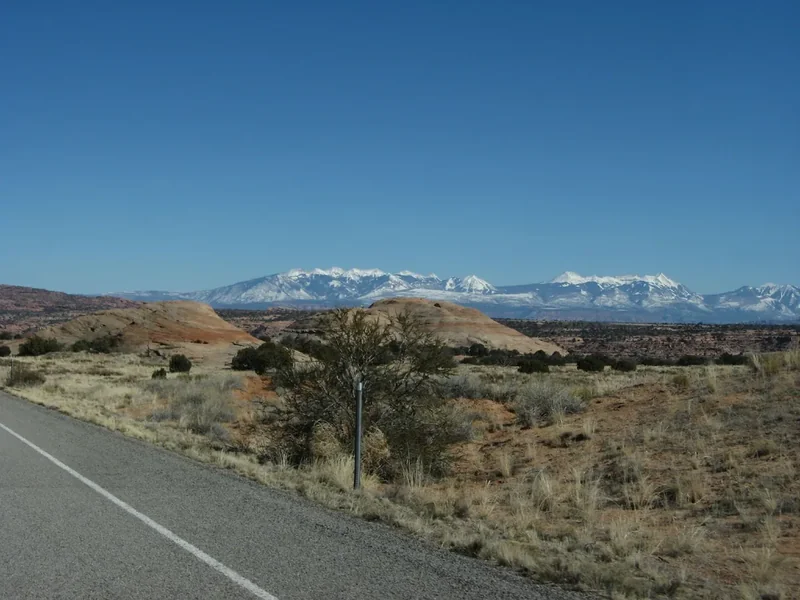 The snowy La Sal Mountains seen from Utah State Route 313 near Moab