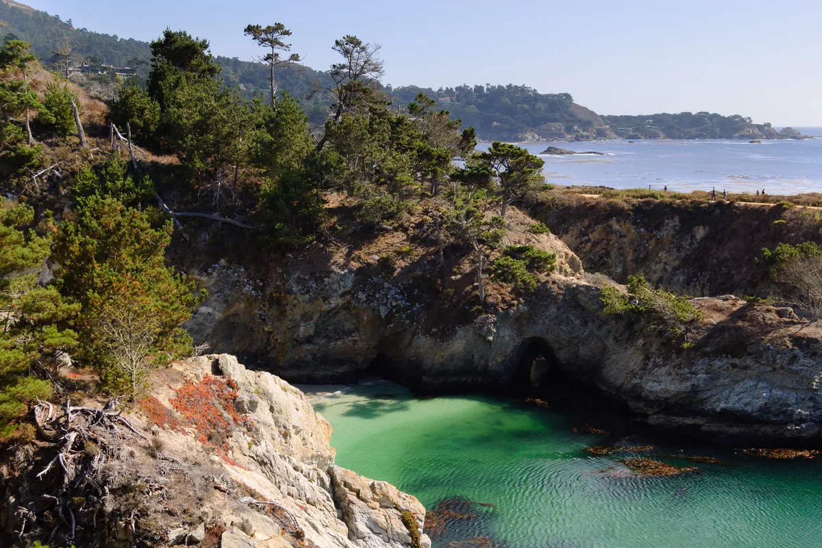 A turquoise cove with rocks and cypress at Point Lobos