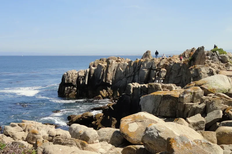 Lovers Point Park with rocks and a small beach in Pacific Grove