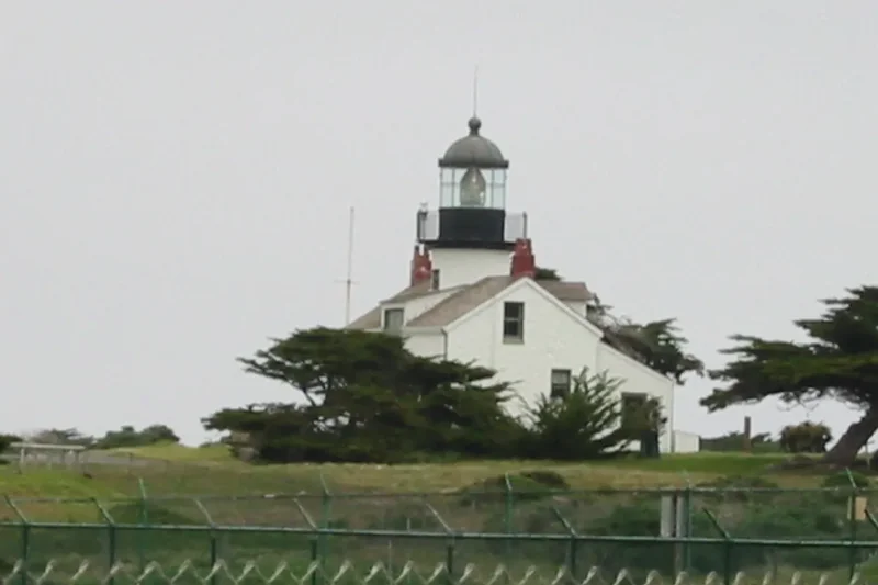 Point Pinos Lighthouse, a small white lighthouse with a tower, in Pacific Grove