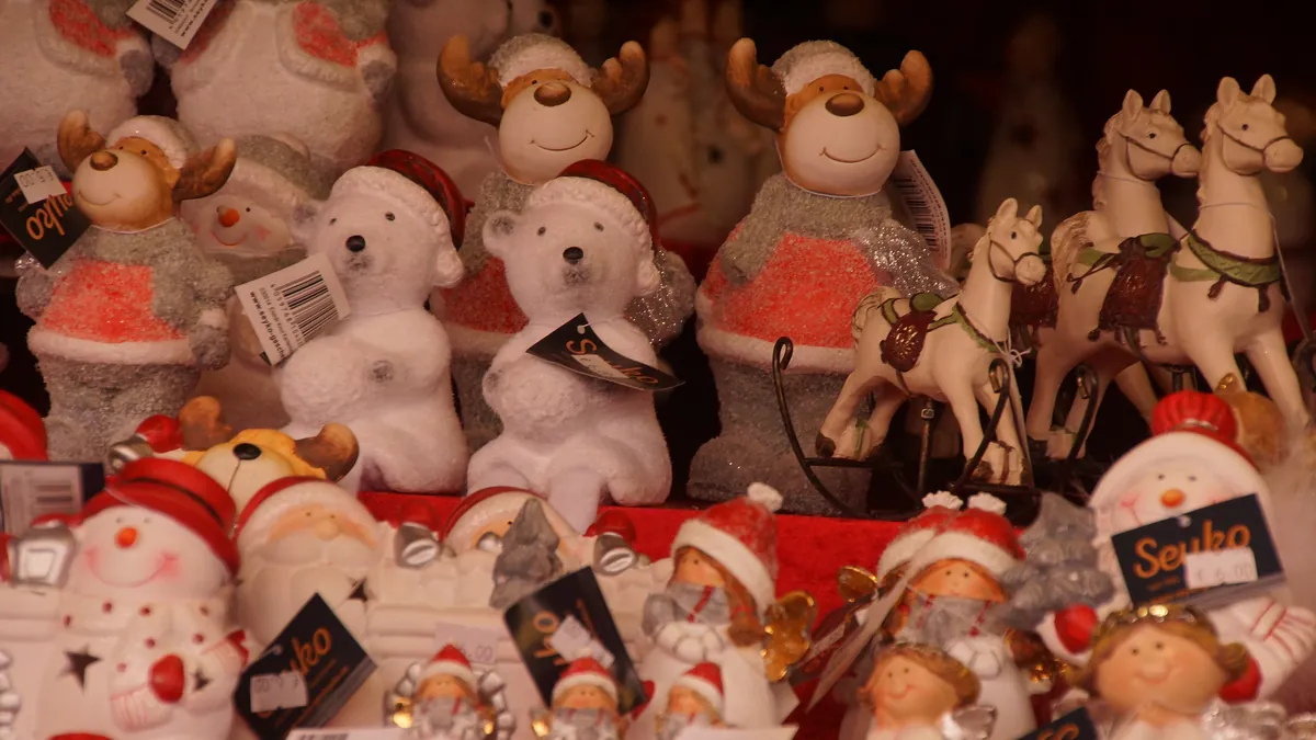 Stalls with red-and-white striped roofs at the Nuremberg Christkindlesmarkt on the Hauptmarkt