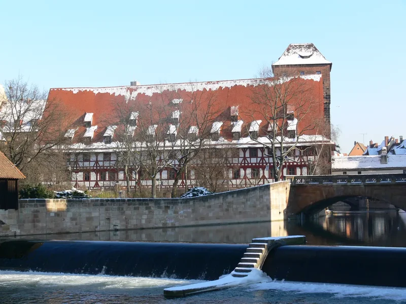 The half-timbered Weinstadel building beside the Pegnitz river in Nuremberg