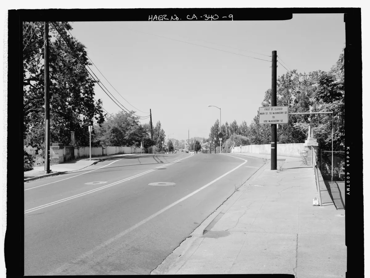 A black and white view across the First Street Bridge toward downtown Napa