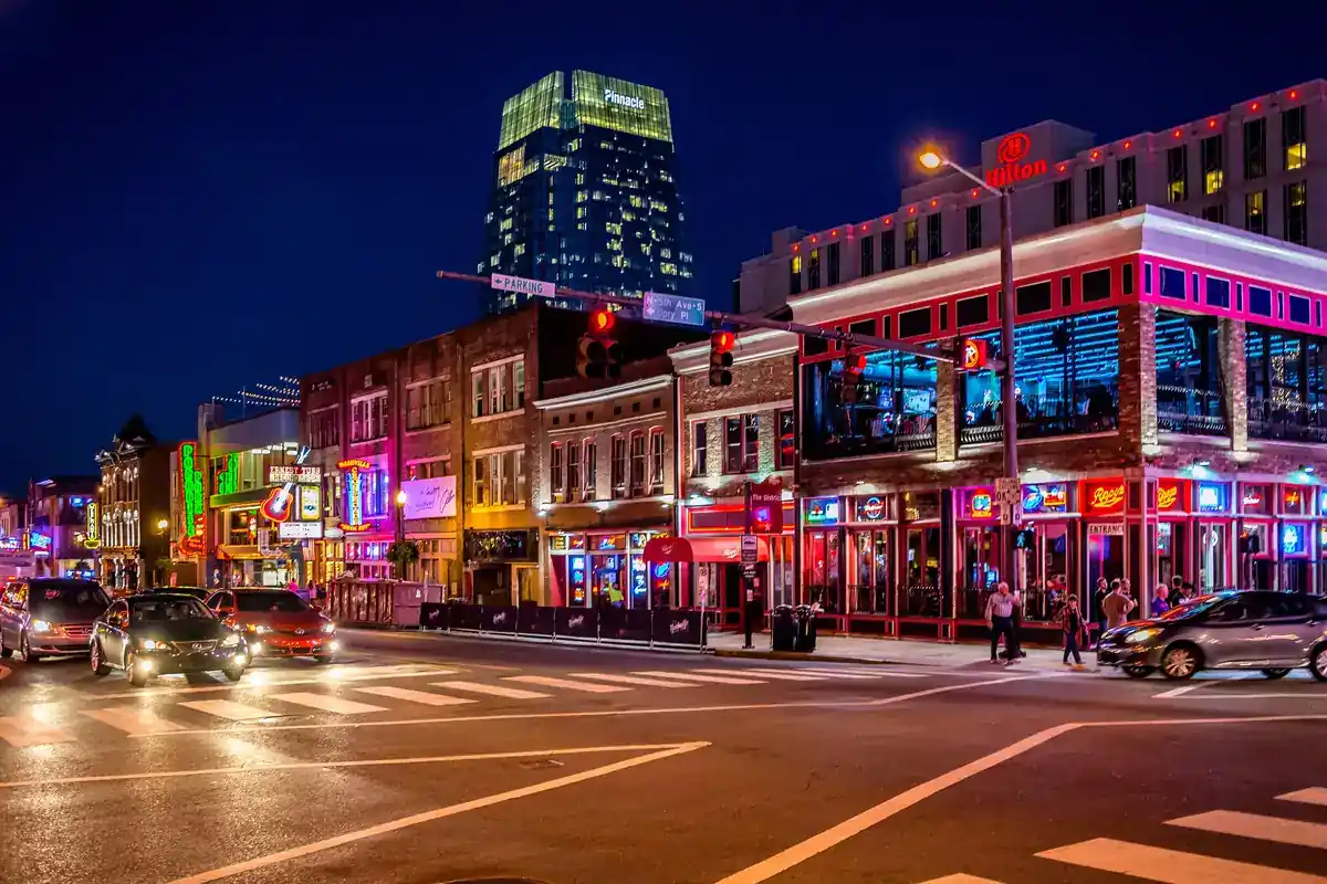 Broadway's neon corridor glowing at night