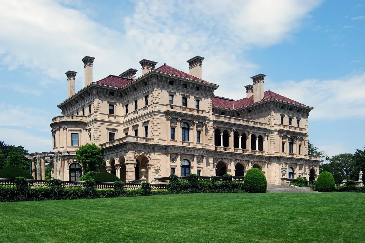 The Breakers mansion in Newport, Rhode Island, a pale stone Italian Renaissance-style house on a wide lawn