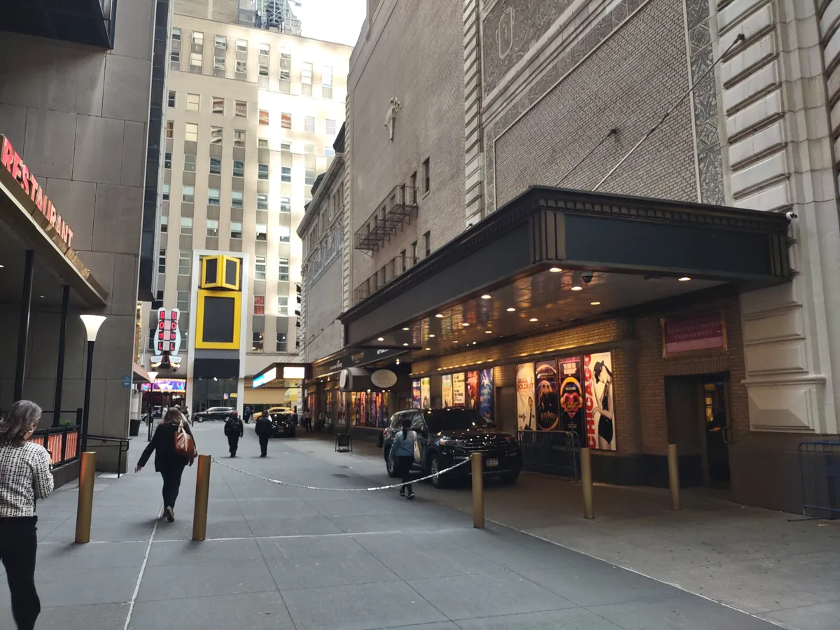 Shubert Alley in Manhattan, a narrow lane lined with Broadway show posters between brick theater walls