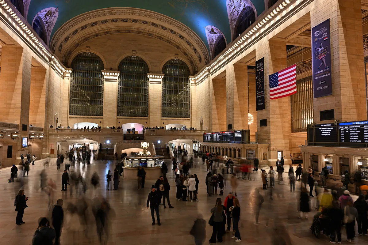 The main concourse of Grand Central Terminal with its arched windows, information booth and vaulted ceiling