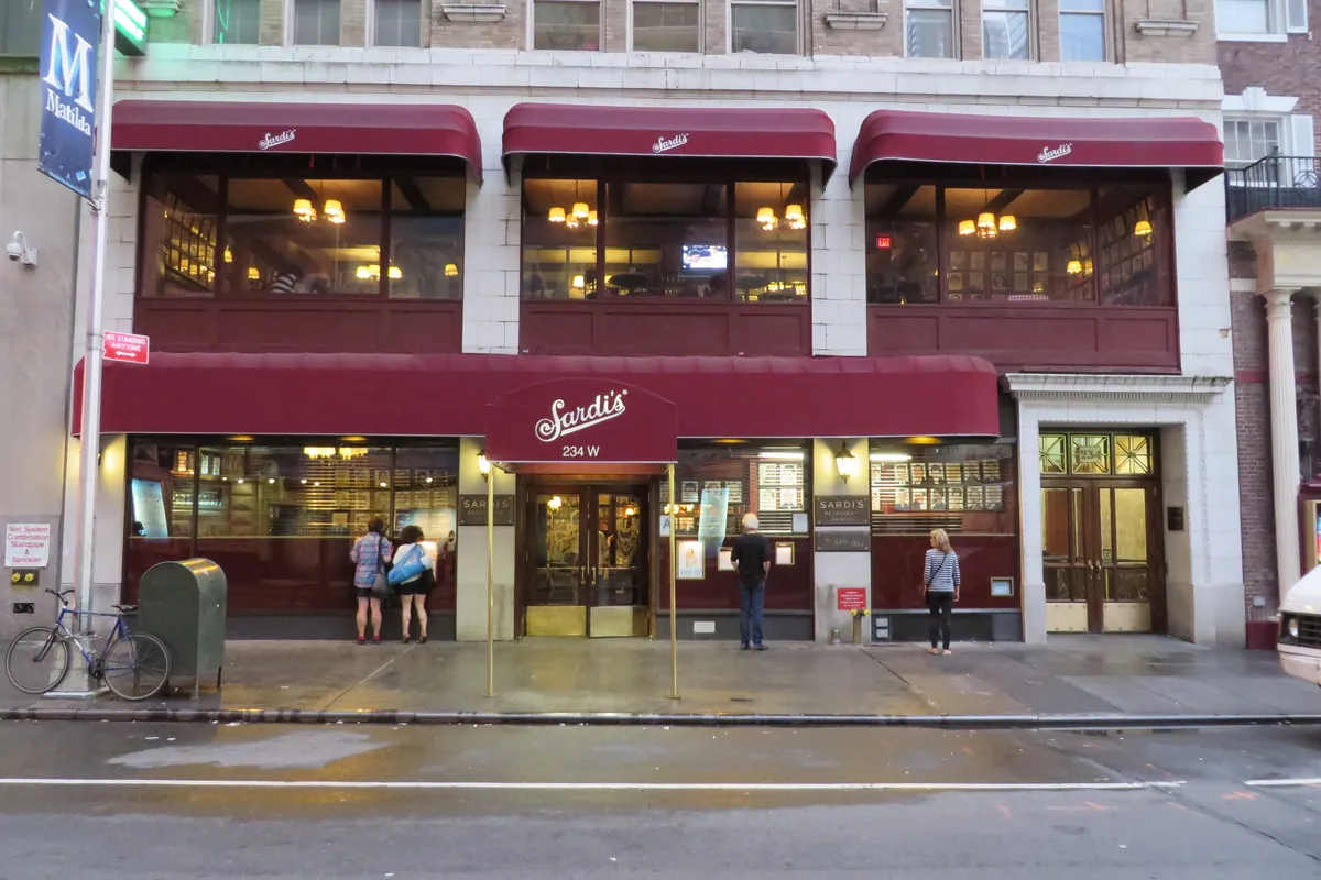 The red awning and entrance of Sardi’s restaurant on West 44th Street in the Theater District