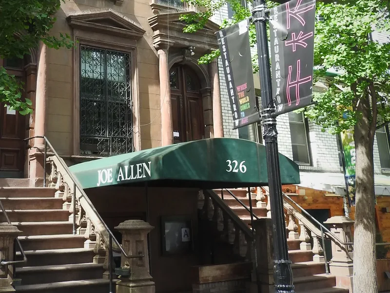 The awning of a restaurant on West 46th Street on Restaurant Row, seen from across the street