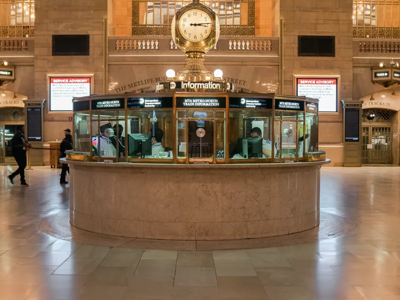 The four-faced clock on the information booth in the Grand Central Terminal concourse