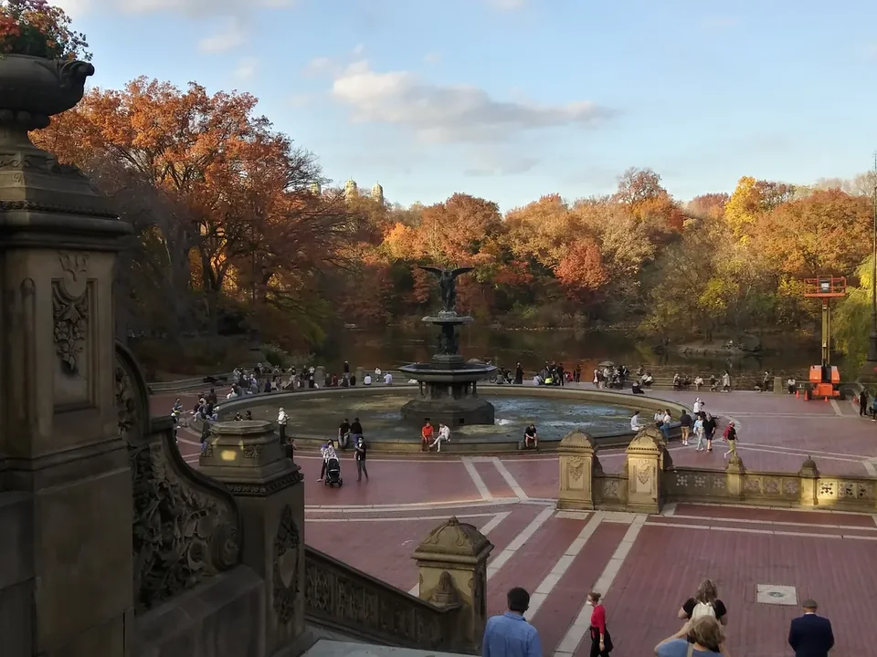 Bethesda Terrace and Fountain in Central Park in November, with the Lake and bare trees behind