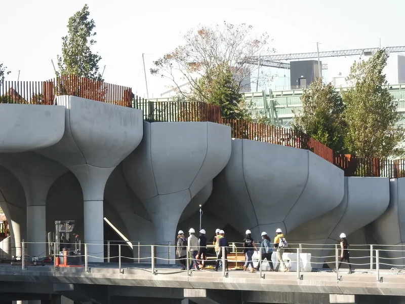 Little Island at Pier 55, raised above the Hudson on sculpted concrete supports, seen on a sunny afternoon