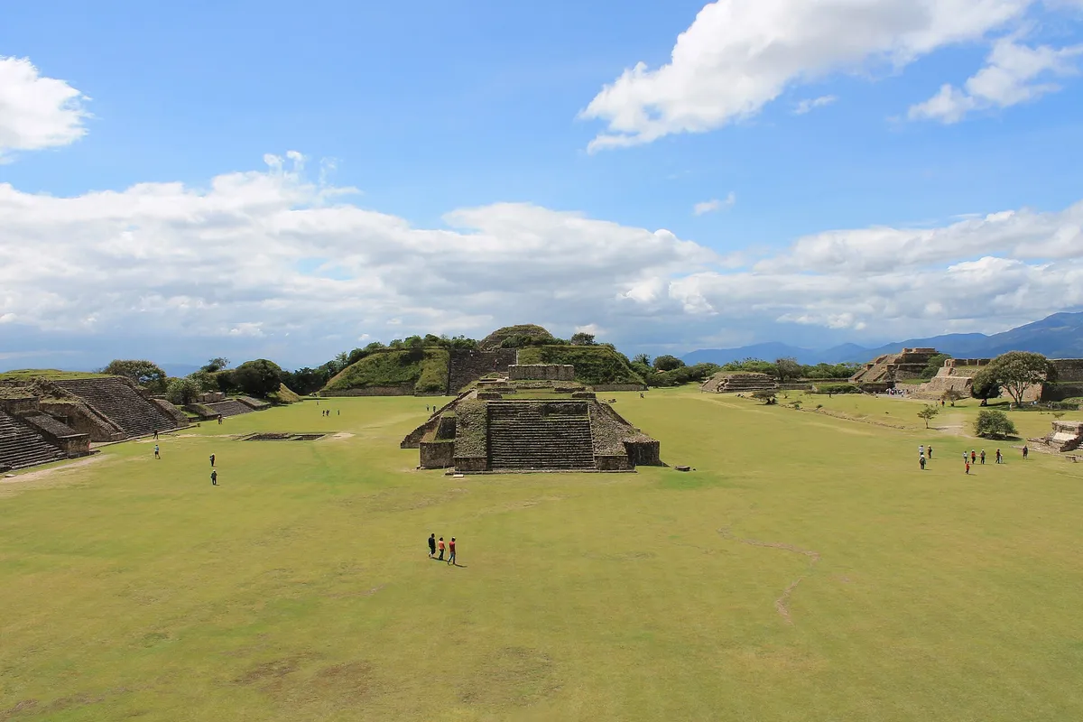 The Grand Plaza of Monte Albán with stepped stone platforms and the valley beyond
