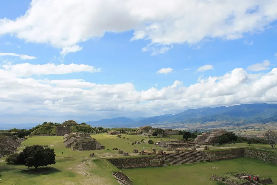 A panorama of Monte Albán’s open plaza and platforms under a wide sky