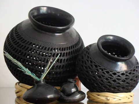 Black clay pots and figures of barro negro from Oaxaca on a table
