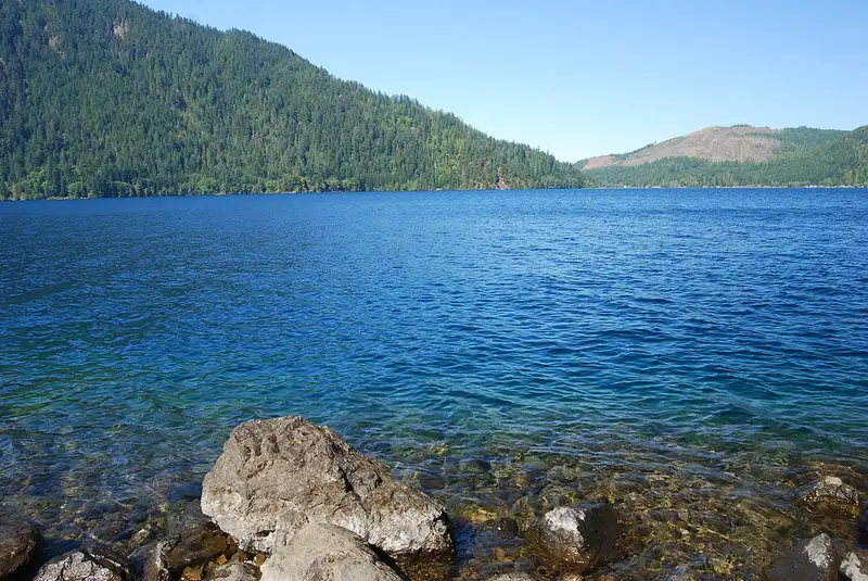The deep blue water of Lake Crescent below forested ridges
