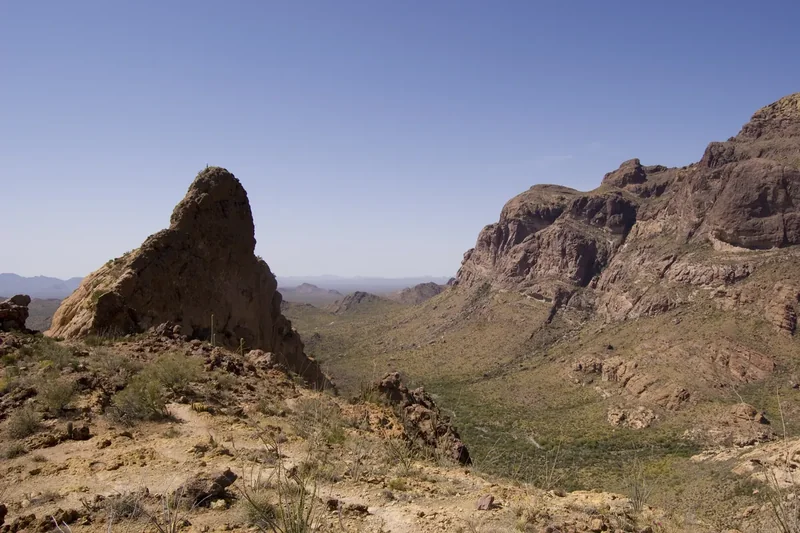 Estes Canyon seen from the rocky Bull Pasture Trail, with saguaros on the slopes below the cliffs