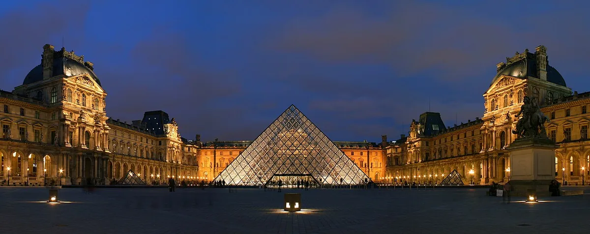 The Louvre Pyramid glowing at night