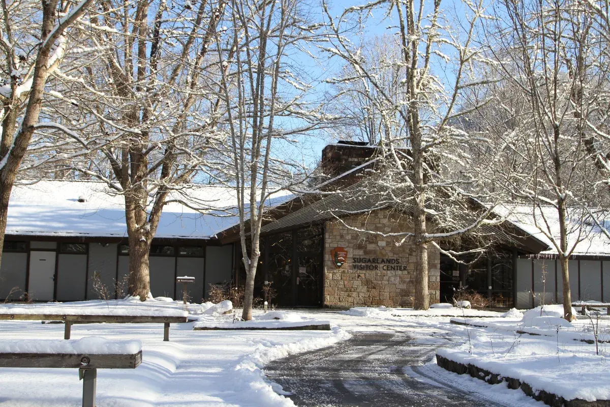 Sugarlands Visitor Center in the Smokies after a snowfall, bare trees around it