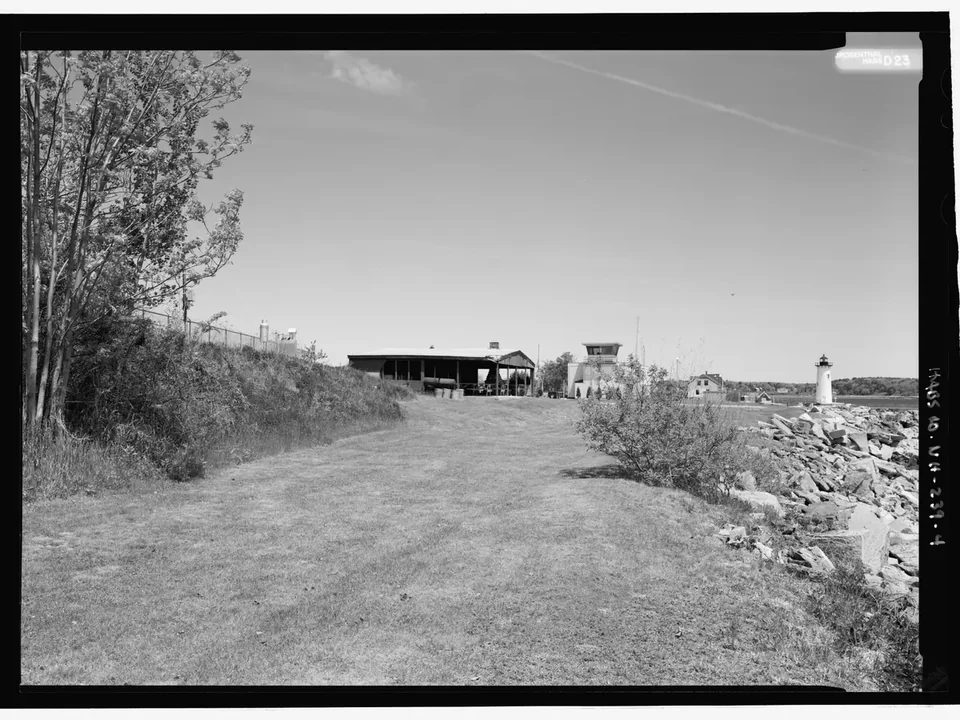 The grassy berm and old walls at Fort Point in New Castle, in black and white