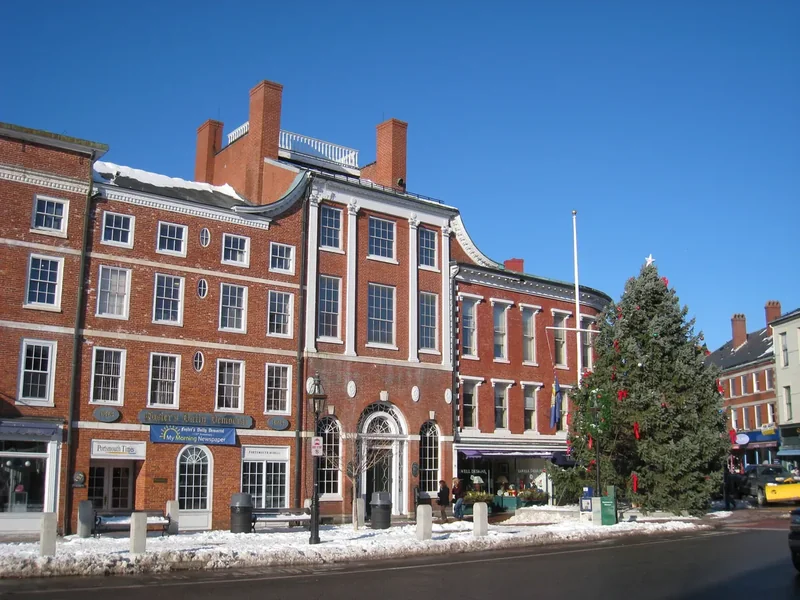 Market Square in Portsmouth in winter with brick buildings and a decorated tree