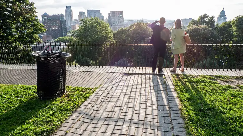 A couple taking in the view from Prospect Terrace over downtown Providence