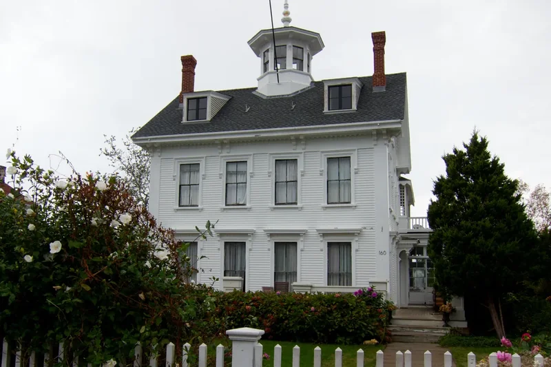 A white clapboard house with a picket fence in Provincetown