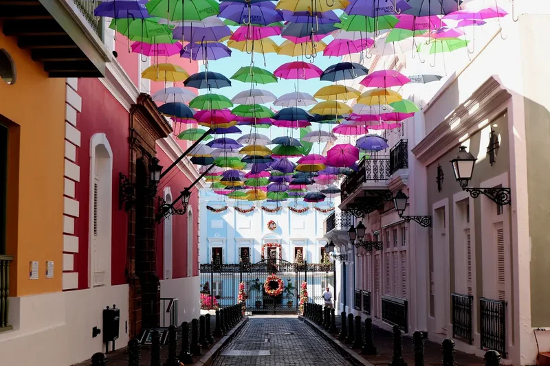 Colorful umbrellas strung above Calle Fortaleza in Old San Juan
