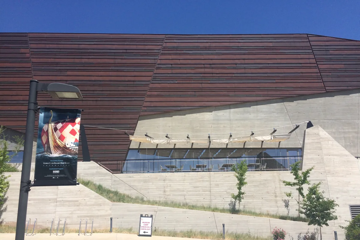 The banded copper-colored facade of the Rio Tinto Center, home of the Natural History Museum of Utah