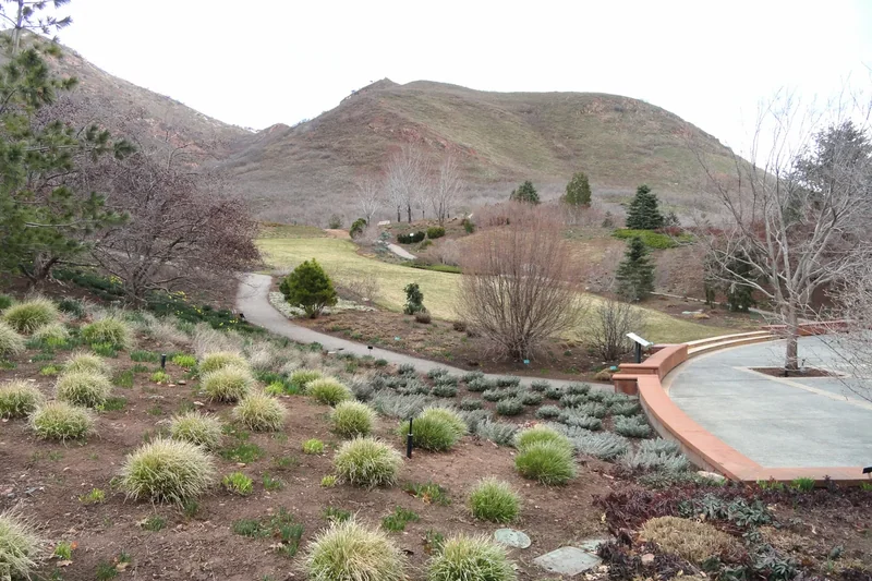 Paths and plantings at Red Butte Garden with the valley beyond